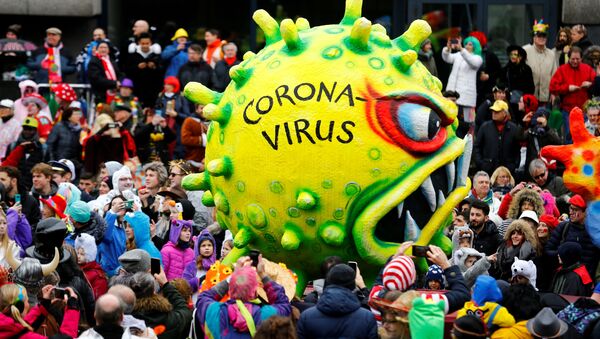 A figures depicting the coronavirus is pictured during the Rosenmontag (Rose Monday) parade in Duesseldorf, Germany February 24, 2020 - Sputnik International