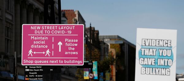 A social distancing sign is seen amid the spread of the coronavirus disease (COVID-19) in Newcastle, Britain, September 18, 2020.  - Sputnik International