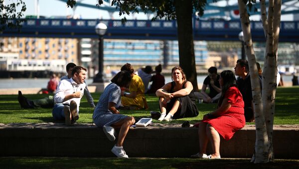 People sit in a park, as the spread of coronavirus disease (COVID-19) continues, in London, Britain, 14 September 2020 - Sputnik International