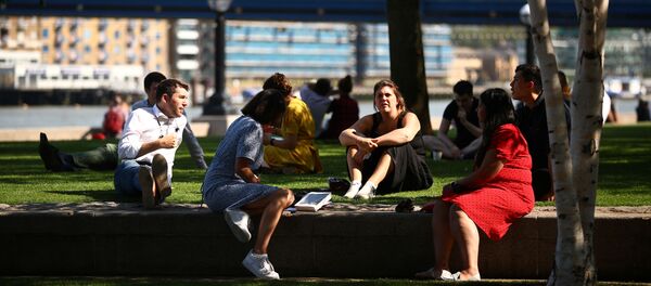 People sit in a park, as the spread of coronavirus disease (COVID-19) continues, in London, Britain, 14 September 2020 People sit in a park, as the spread of coronavirus disease (COVID-19) continues, in London, Britain, 14 September 2020 - Sputnik International