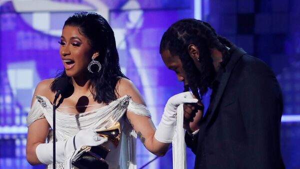 61st Grammy Awards - Show - Los Angeles, California, U.S., February 10, 2019 - Cardi B accepts the Best Rap Album award for Invasion of Privacy as her husband Offset kisses her hand - Sputnik International