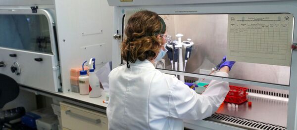 A scientist works during the visit of Britain's William, Duke of Cambridge, to the manufacturing laboratory where a vaccine against the coronavirus disease (COVID-19) has been produced at the Oxford Vaccine Group's facility at the Churchill Hospital in Oxford, Britain, 24 June 2020 A scientist works during the visit of Britain's William, Duke of Cambridge, to the manufacturing laboratory where a vaccine against the coronavirus disease (COVID-19) has been produced at the Oxford Vaccine Group's facility at the Churchill Hospital in Oxford, Britain, 24 June 2020 - Sputnik International