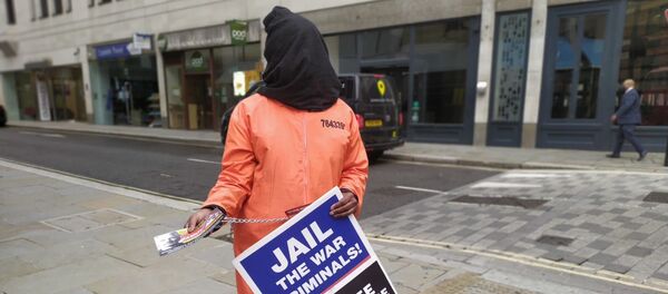 Hooded woman in orange jumpsuit replica outside Old Bailey during Mr Assange's extradition hearings 23 September 2020 Hooded woman in orange jumpsuit replica outside Old Bailey during Mr Assange's extradition hearings 23 September 2020 - Sputnik International