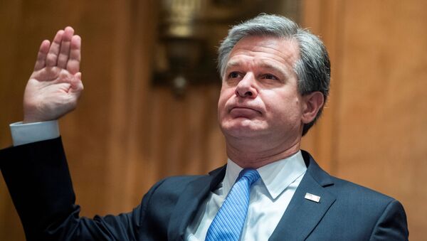 FBI Director Christopher Wray, is sworn into the Senate Homeland Security and Governmental Affairs Committee during a hearing on Threats to the Homeland, on Capitol Hill in Washington, U.S., September 24, 2020. - Sputnik International