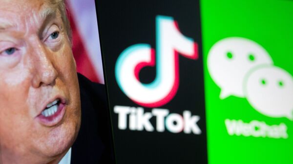 A picture of U.S. President Donald Trump is seen on a smartphone in front of displayed Tik Tok and WeChat logos in this illustration taken September 18, 2020. - Sputnik International