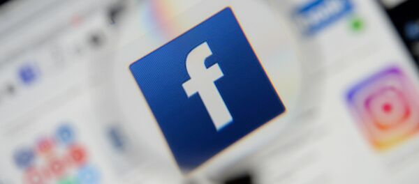 The Facebook logo is seen on a screen in this picture illustration taken December 2, 2019.  - Sputnik International