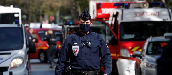 A police officer is seen at the scene of an incident near the former offices of French magazine Charlie Hebdo, in Paris, France September 25, 2020 - Sputnik International
