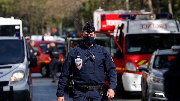 A police officer is seen at the scene of an incident near the former offices of French magazine Charlie Hebdo, in Paris, France September 25, 2020 - Sputnik International