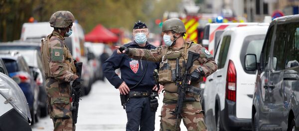 Security forces guard the scene of an incident near the former offices of French magazine Charlie Hebdo, in Paris, France September 25, 2020 Security forces guard the scene of an incident near the former offices of French magazine Charlie Hebdo, in Paris, France September 25, 2020 - Sputnik International