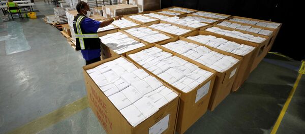 An election worker surveys thousands of absentee ballots awaiting preparation at the Wake County Board of Elections on the first day that the state started mailing out absentee ballots, in Raleigh, North Carolina, U.S. September 4, 2020. An election worker surveys thousands of absentee ballots awaiting preparation at the Wake County Board of Elections on the first day that the state started mailing out absentee ballots, in Raleigh, North Carolina, U.S. September 4, 2020. - Sputnik International