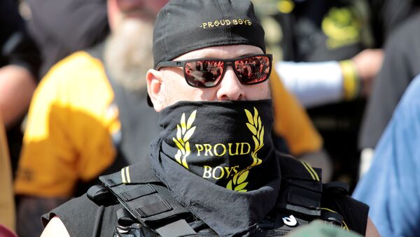 An armed member of the 'Proud Boys' attends a '2nd Amendment' rally outside the Michigan Supreme Court Building in Lansing, Michigan, US 17 September 2020. - Sputnik International