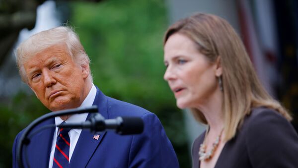 U.S President Donald Trump watches U.S. Court of Appeals for the Seventh Circuit Judge Amy Coney Barrett deliver remarks as he holds an event to announce her as his nominee to fill the Supreme Court seat left vacant by the death of Justice Ruth Bader Ginsburg, who died on September 18, at the White House in Washington, U.S., September 26, 2020 - Sputnik International