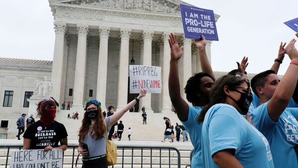 Protestors demonstrate outside the U.S. Supreme Court after US President Donald Trump announced US Court of Appeals Judge Amy Coney Barrett as his nominee to fill the Supreme Court seat left vacant by the death of Justice Ruth Bader Ginsburg, in Washington, US, September 26, 2020 - Sputnik International