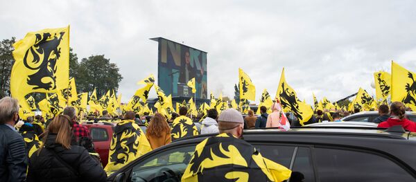 Flemish Interest activists gather around a bus during a rally in Brussels, Belgium, 27 September 2020 Flemish Interest activists gather around a bus during a rally in Brussels, Belgium, 27 September 2020 - Sputnik International