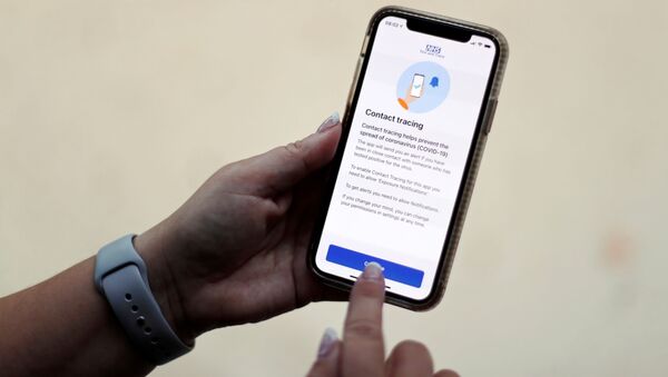 The coronavirus disease (COVID-19) contact tracing smartphone app of Britain's National Health Service (NHS) is displayed on an iPhone in this illustration photograph taken in Keele, Britain, September 24, 2020.  - Sputnik International