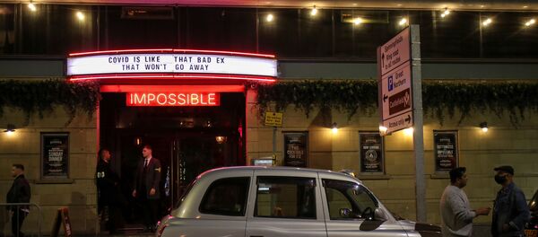 A sign is seen above the entrance of a bar, amid the coronavirus disease (COVID-19) outbreak, in Manchester, Britain September 24, 2020.  - Sputnik International