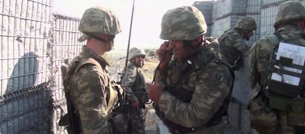 In this handout video grab released by the Azerbaijan Defence Ministry, Azeri military personnel conduct military operations in self-proclaimed Republic of Artsakh, Nagorno-Karabakh, Azerbaijan. On September 27 clashes erupted between Armenian and Azeri forces along the line of contact in the disputed region of Nagorno-Karabakh In this handout video grab released by the Azerbaijan Defence Ministry, Azeri military personnel conduct military operations in self-proclaimed Republic of Artsakh, Nagorno-Karabakh, Azerbaijan. On September 27 clashes erupted between Armenian and Azeri forces along the line of contact in the disputed region of Nagorno-Karabakh - Sputnik International