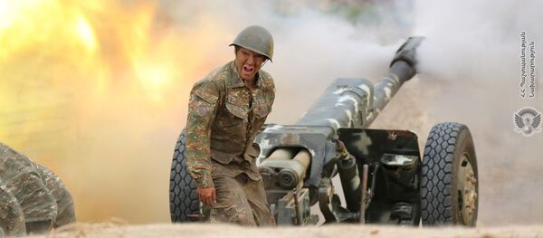 An ethnic Armenian soldier fires an artillery piece during fighting with Azerbaijan's forces in the breakaway region of Nagorno-Karabakh, in this handout picture released September 29, 2020 An ethnic Armenian soldier fires an artillery piece during fighting with Azerbaijan's forces in the breakaway region of Nagorno-Karabakh, in this handout picture released September 29, 2020 - Sputnik International