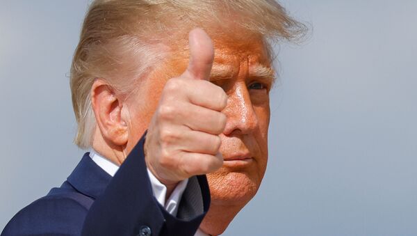 U.S. President Donald Trump gestures while boarding Air Force One as he departs Washington on campaign travel to participate in the first presidential debate with Democratic presidential nominee Joe Biden in Cleveland, Ohio at Joint Base Andrews, Maryland, U.S., September 29, 2020. - Sputnik International