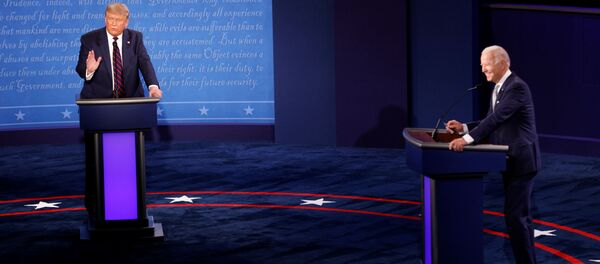 U.S. President Donald Trump and Democratic presidential nominee Joe Biden participate in their first 2020 presidential campaign debate held on the campus of the Cleveland Clinic at Case Western Reserve University in Cleveland, Ohio, U.S., September 29, 2020. - Sputnik International