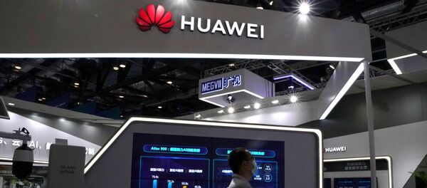 A man wearing a face mask following the coronavirus disease (COVID-19) outbreak walks past a booth of Huawei at the 2020 China International Fair for Trade in Services (CIFTIS) in Beijing, China September 4, 2020 A man wearing a face mask following the coronavirus disease (COVID-19) outbreak walks past a booth of Huawei at the 2020 China International Fair for Trade in Services (CIFTIS) in Beijing, China September 4, 2020 - Sputnik International