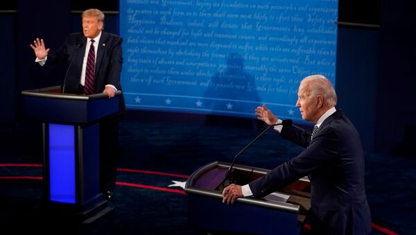 U.S. President Donald Trump and Democratic presidential nominee Joe Biden participate in their first 2020 presidential campaign debate held on the campus of the Cleveland Clinic at Case Western Reserve University in Cleveland, Ohio, U.S., September 29, 2020 - Sputnik International