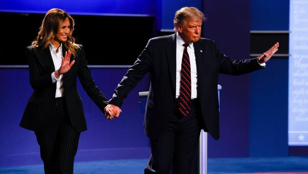 President Donald Trump and first lady Melania Trump wave as they leave the stage at the conclusion of  U.S. President Donald Trump and Democratic presidential nominee Joe Biden participate first 2020 presidential campaign debate held on the campus of the Cleveland Clinic at Case Western Reserve University in Cleveland, Ohio, U.S., September 29, 2020 - Sputnik International