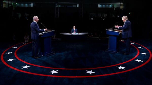 U.S. President Donald Trump and Democratic presidential nominee Joe Biden participate in the first 2020 presidential campaign debate held on the campus of the Cleveland Clinic at Case Western Reserve University in Cleveland, Ohio, U.S., September 29, 2020. - Sputnik International