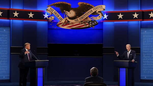 President Donald Trump, left, and Democratic presidential candidate former Vice President Joe Biden, right, with moderator Chris Wallace, center, of Fox News during the first presidential debate Tuesday, Sept. 29, 2020, at Case Western University and Cleveland Clinic, in Cleveland, Ohio. - Sputnik International
