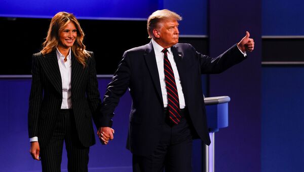 U.S. President Donald Trump and first lady Melania Trump leave the stage at the conclusion of the first 2020 presidential campaign debate with Democratic presidential nominee Joe Biden, held on the campus of the Cleveland Clinic at Case Western Reserve University in Cleveland, Ohio, U.S., September 29, 2020. - Sputnik International