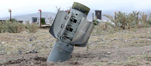 The remains of a rocket shell are seen near a graveyard in the town of Ivanyan (Khojaly) in the breakaway region of Nagorno-Karabakh, October 1, 2020 The remains of a rocket shell are seen near a graveyard in the town of Ivanyan (Khojaly) in the breakaway region of Nagorno-Karabakh, October 1, 2020 - Sputnik International