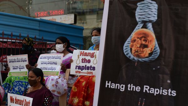 Members of the National Federation of Indian Women (NFIW) hold placards during a protest following accusations of Indian Police forcibly cremating the body of a 19-year-old woman victim, who was allegedly gang-raped by four men in Bool Garhi village of Uttar Pradesh state, in Hyderabad on October 2, 2020.  - Sputnik International