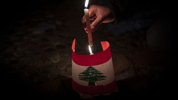 Lebanese living in Chile hold a candle-lit vigil in front of their embassy in Santiago, in memory of the victims of the Beirut blast, on August 10, 2020 - Sputnik International