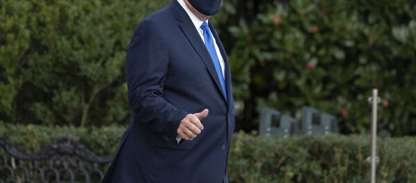 President Donald Trump gives thumbs up as he leaves the White House to go to Walter Reed National Military Medical Center after he tested positive for COVID-19, Friday, Oct. 2, 2020, in Washington. - Sputnik International