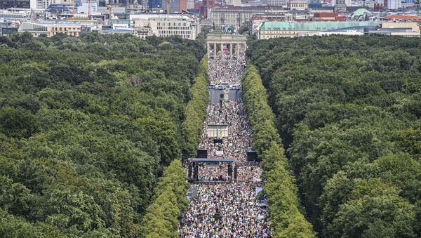 People take part in a demonstration by the initiative Querdenken-711 with the slogan the end of the pandemic-the day of freedom to protest against the current measurements to curb the COVID-19 spreading in Berlin, on August 1, 2020. - Sputnik International