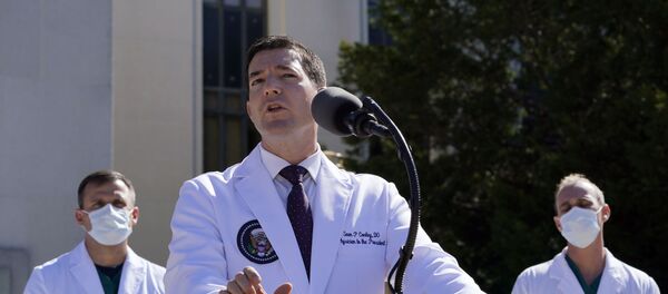 Dr. Sean Conley, physician to President Donald Trump, briefs reporters at Walter Reed National Military Medical Center in Bethesda, Md., Saturday, Oct. 3, 2020. Trump was admitted to the hospital after contracting the coronavirus. (AP Photo/Susan Walsh) - Sputnik International