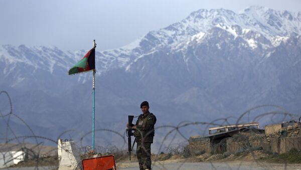 In this Wednesday, April 8, 2020, file photo, an Afghan National Army soldier stands guard at a checkpoint near the Bagram base north of Kabul, Afghanistan. - Sputnik International