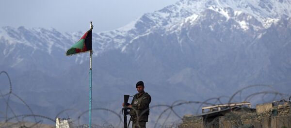 In this Wednesday, April 8, 2020, file photo, an Afghan National Army soldier stands guard at a checkpoint near the Bagram base north of Kabul, Afghanistan. - Sputnik International
