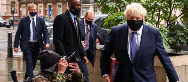 British Prime Minister Boris Johnson is seen outside the BBC headquarters, as the spread of the coronavirus disease (COVID-19) continues, in London, Britain, October 4, 2020 - Sputnik International