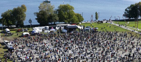 A general view taken from a wheel shows people gathering during a protest against the government's restrictions, amid the coronavirus disease (COVID-19) outbreak, in Konstanz, Germany October 4, 2020 A general view taken from a wheel shows people gathering during a protest against the government's restrictions, amid the coronavirus disease (COVID-19) outbreak, in Konstanz, Germany October 4, 2020 - Sputnik International