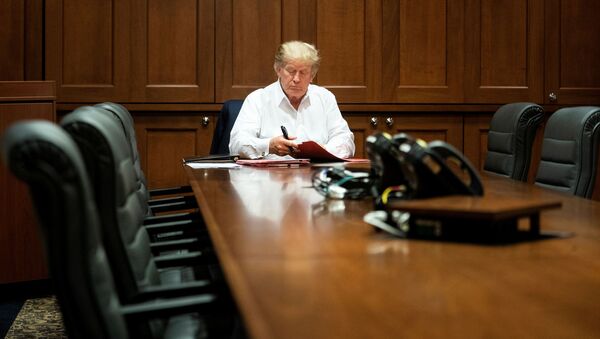 US President Donald Trump works in a conference room while receiving treatment after testing positive for the coronavirus disease (COVID-19) at Walter Reed National Military Medical Center in Bethesda, Maryland, U.S. October 3, 2020. Joyce N. - Sputnik International