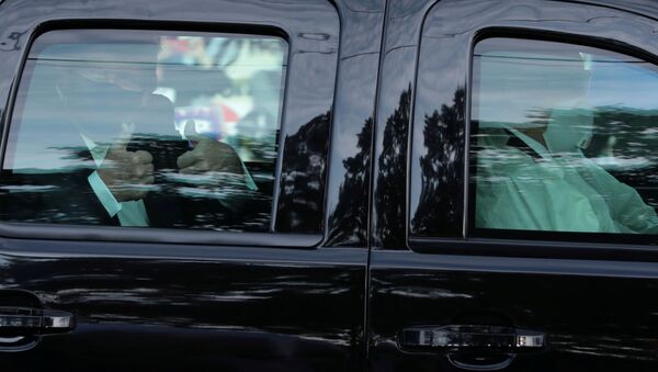 U.S. President Donald Trump rides in front of  the Walter Reed National Military Medical Center, where he is being treated for the coronavirus disease (COVID-19) in Bethesda, Maryland, U.S. October 4, 2020. - Sputnik International
