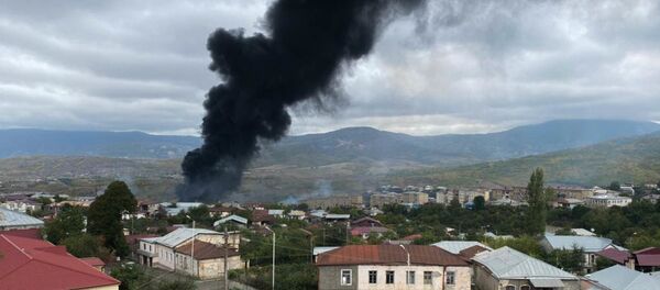 Smoke rises after the recent shelling, in Stepanakert, the self-proclaimed Republic of Nagorno-Karabakh. The situation in Nagorno-Karabakh escalated on September 27, when Yerevan and Baku accused each other of provoking military hostilities. - Sputnik International