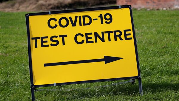 A sign is seen outside a walk-in test facility following the outbreak of the coronavirus disease (COVID-19) in the Farnworth area of Bolton, Britain, September 15, 2020 - Sputnik International