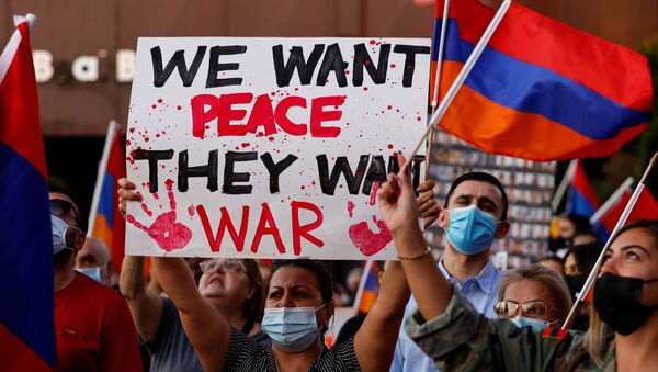 People take part in a protest by Armenian Youth Federation against what they call Azerbaijan's aggression against Armenia and the breakaway Nagorno-Karabakh region outside the Azerbaijani Consulate General in Los Angeles, California, U.S., September 30, 2020.  - Sputnik International