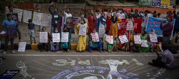 Indians shout slogans and hold placards during a protest condemning the alleged gang rape and killing of a Dalit woman, in New Delhi, India, Sunday, Oct. 4, 2020 Indians shout slogans and hold placards during a protest condemning the alleged gang rape and killing of a Dalit woman, in New Delhi, India, Sunday, Oct. 4, 2020 - Sputnik International