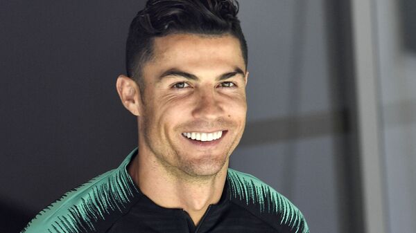 In this June 8, 2019, file photo, Portugal's Cristiano Ronaldo smiles when he arrives to a training session at the Bessa stadium in Porto, Portugal. Soccer star Cristiano Ronaldo won’t face criminal charges after a woman accused him of raping her at a Las Vegas Strip resort in 2009 - Sputnik International