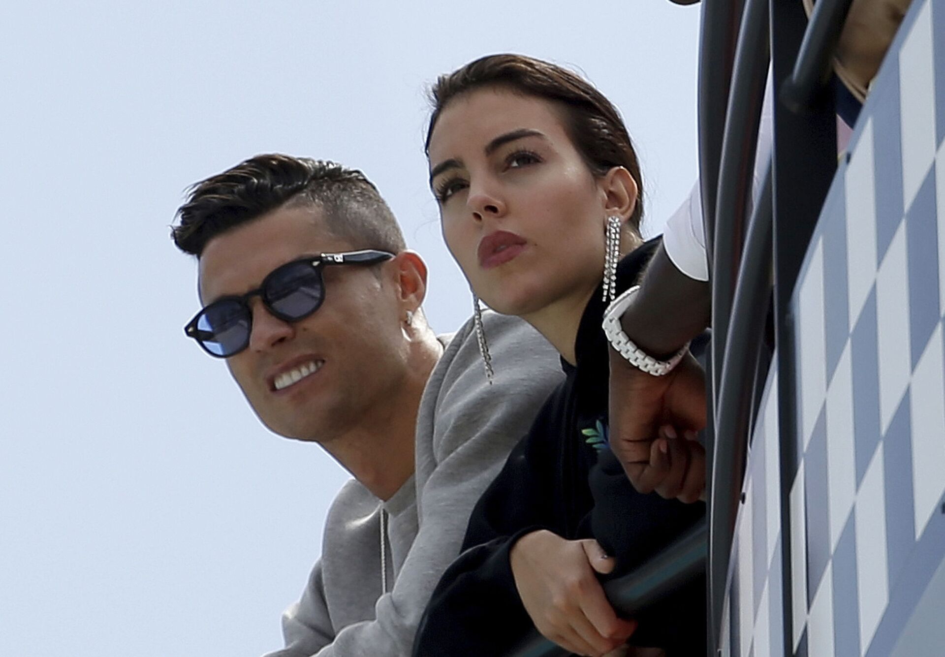  In this May 23, 2019, file photo, Cristiano Ronaldo, left, is flanked by his partner Georgina Rodriguez as they watch the second practice session for a Formula One race at the Monaco racetrack, in Monaco - Sputnik International, 1920, 07.09.2021