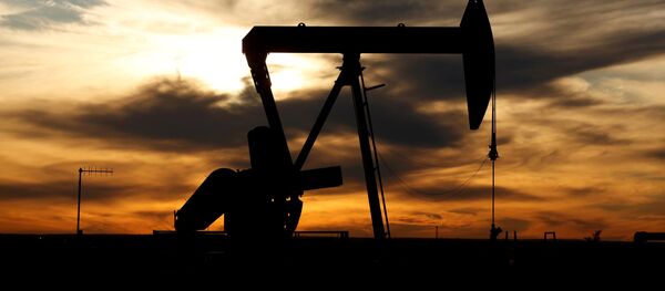 FILE PHOTO: the sun sets behind a crude oil pump jack on a drill pad in the Permian Basin in Loving County, Texas, U.S. November 24, 2019. Picture taken November 24, 2019 - Sputnik International
