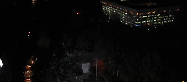Screenshot from a drone video showing the White House in Bishkek in first minutes after seizure by protesters Screenshot from a drone video showing the White House in Bishkek in first minutes after seizure by protesters - Sputnik International